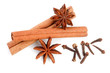 Cinnamon sticks with star anise and clove isolated on white background. Top view