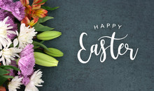 Spring Season Still Life With Happy Easter Calligraphy Holiday Script Over Dark Blackboard Background Texture With Beautiful Colorful White, Pink, Orange, Purple And Green Flower Blossom Bouquet