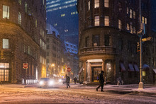 People Cross The Street In New York City During A Snow Storm