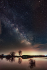 Wall Mural - Milky Way over the lake. Milky Way galaxy over the Dojran Lake, FYR Macedonia. The night sky is astronomically accurate.