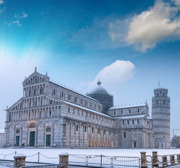 Canvas Print - Baptistery of Pisa after a winter snowfall at sunset. Square of Miracles at dawn