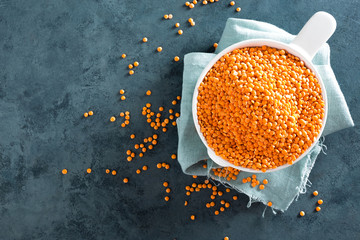 Raw lentil in bowl on table. Fresh lentils. Vegetarian food. Top view