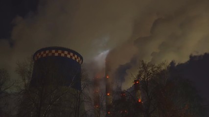 Wall Mural -  Gas Thermal power plant emits steam in the atmosphere on a cold moonlit night,