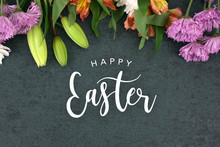 Happy Easter Text With Beautiful Colorful Flowers Bouquet Border Shot From Directly Above Over Black Dark Texture Background, Horizontal