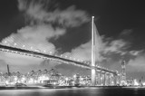 Fototapeta  - Suspension bridge and cargo port in Hong Kong city