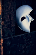 Phantom Of The Opera Mask On A Dark Gritty Retro Vintage Steel Bridge