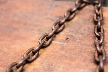 rusty chain on wooden background