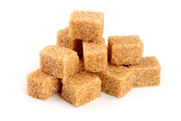 Wall Mural - brown sugar cubes isolated on white background