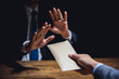© Atstock Productions - Businessman rejecting money in the envelope, anti bribery concept
