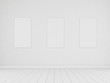 3D stimulate of white room space and light plank wood floor texture with white blank of three picture frame on the wall,Perspective of future design building
