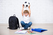 © Di Studio - little boy in glasses with school tools and soccer ball