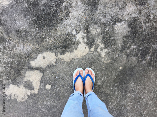 Blue Flip Flop Isolated On Cement FloorTop View Beautiful Woman Wearing Shoes Blue Flip Flop Isolated On Cement FloorTop View Beautiful Woman Wearing Shoes