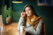 © DanRentea - Young trendy elegant business woman sitting at table with cup of coffee in modern cafe pub in London