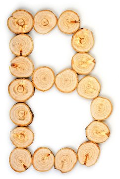 Alphabet letters made from Wood slice on white Background.B.