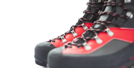 closeup of mountain boots isolated on white. focus on the second boot