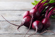 Fresh organic beet, beetroot on grey rustic wooden background. Copy space.