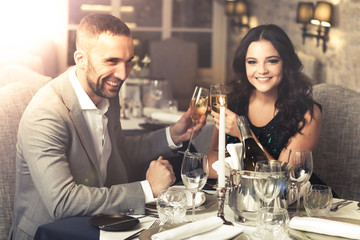 Wall Mural - Couple celebrating in restaurant