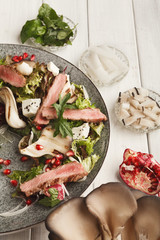 Wall Mural - Warm mix salad with duck meat and mushrooms. Modern restaurant d