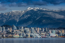 Rocky Mountains And Buildings, North Vancouver, British Colombia, Canada.