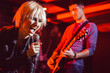 © Kzenon - Band during gig making rock music on stage together