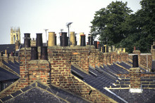 Old Victorian Terraced House Chimney Stacks And Chimney Pots In Lines In The City Of York, UK