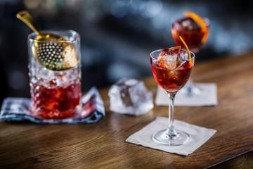 Wall Mural - Manhattan cocktail drink decorated on bar counter in pub or restaurant.