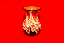 Fragile Vase For Flowers On A Bright Red Background
