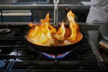 Close Up Of A Frying Pan With Burning  Cauliflower