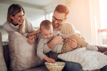 Wall Mural - Happy family having great time at home