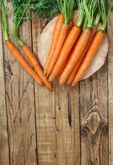 Wall Mural - Fresh raw carrots with leaves
