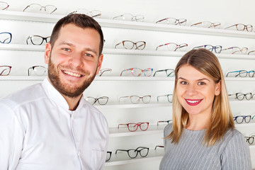 Poster - Ophthalmologist and beautiful patient in optical store