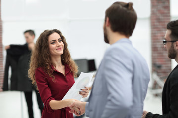 Canvas Print - handshake between the designer and the client