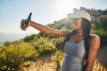 Fit Female African American Hiker Taking A Selfie On Smartphone While Out On Hike