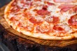 Appetizing fresh pizza with bacon, salami, ham and pepperoni, close up. Italian food, pizzeria concept