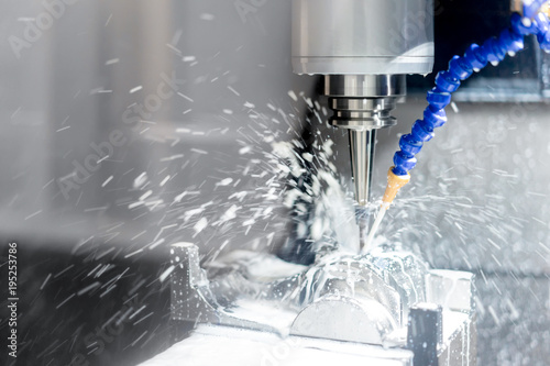 Fotografía High precision CNC machining center working, operator machining automotive sampl
