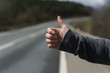 © Milles Studio/Stocksy - Hand of hitchhiking person