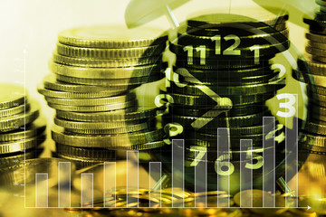 Double exposure of coin stack with alarm clock and financial graph chart, business and banking concept.