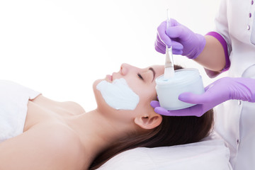 Spa facial mask application. Spa beauty organic facial mask application at day spa salon.