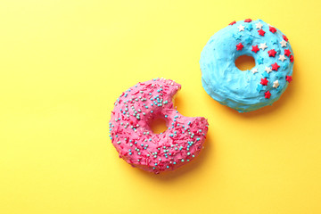 Wall Mural - Delicious colorful donuts on color background