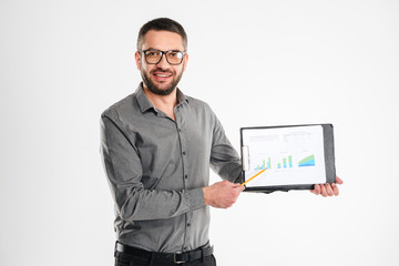 Canvas Print - Handsome businessman showing clipboard.