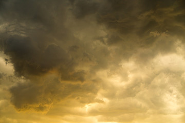 storm clouds in the sky at sunset as background