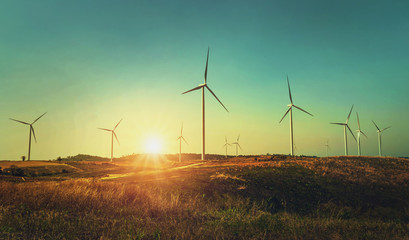 Wall Mural - concept idea eco power energy. wind turbine on hill with sunset