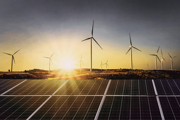 Wall Mural - solar panels with wind turbine and sunset .concept power energy in nature