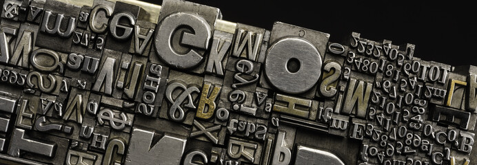 Metal Letterpress Types.
A background from many historical typography letters in black and white with white background.
