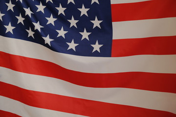 Closeup of American flag on plain background