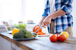 © Viacheslav Yakobchuk - Biohacking research. Selective focus of male hands using knife while touching bell pepper and preparing lunch