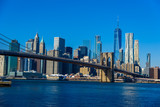 Fototapeta Nowy Jork - Lower Manhattan Downtown skyline panorama from Brooklyn Bridge Park riverbank, New York City, USA