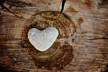 Stone Heart Shape On Wood Background