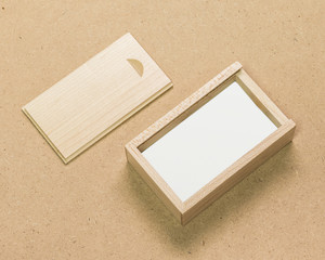 Poster - Small wooden box on brown texture background. Template of wood packaging made from oak material.
