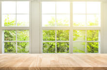 Top Of Wood Table Counter On Blur Window View Garden Background.